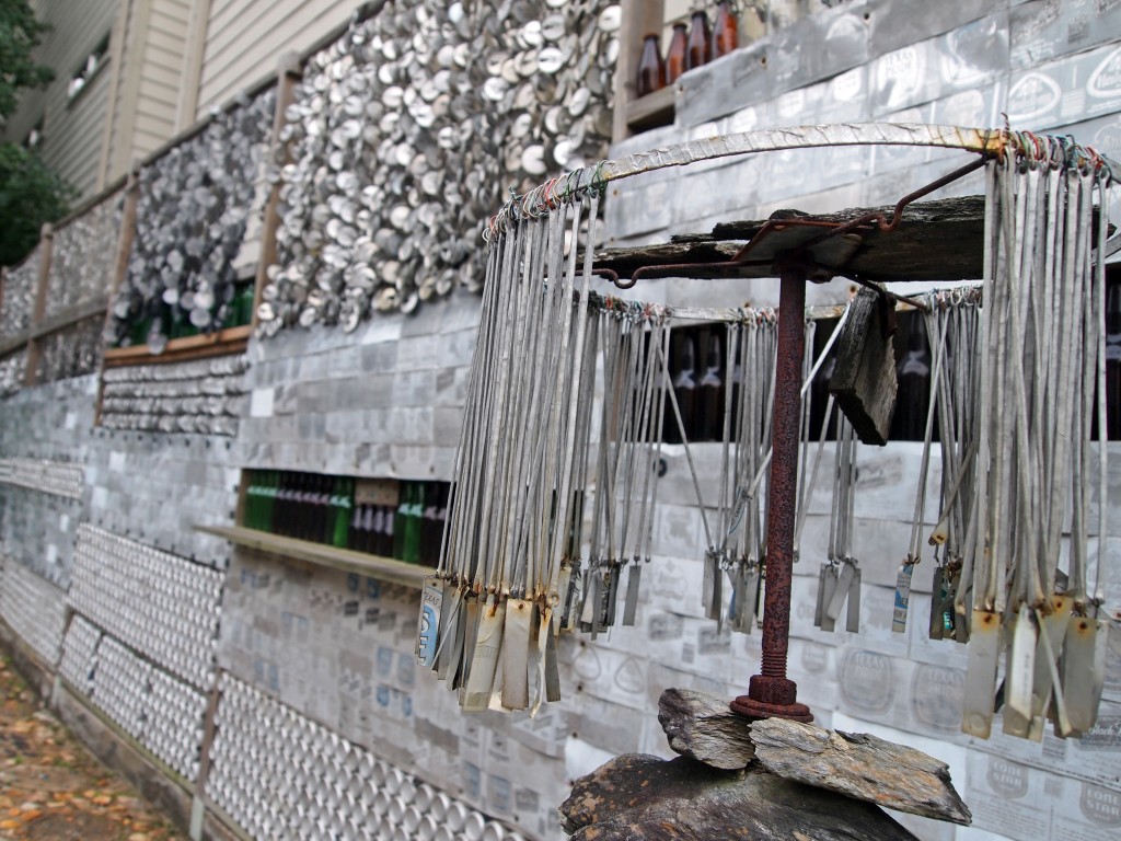 beer can wall and wind chime - beer can house
