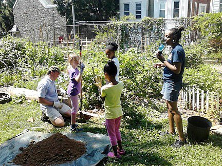 Past Recyclebank Project: Digging a hole for the permanent trellis for the blackberries