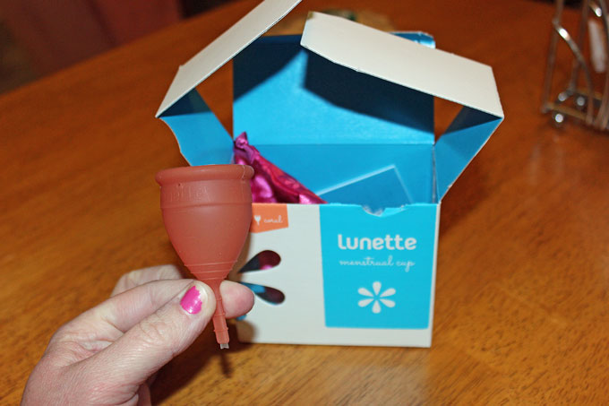 My new menstrual cup. Clearly, the chipped nails and vegan chocolate chip cookie in the background prove it's really me you guys.