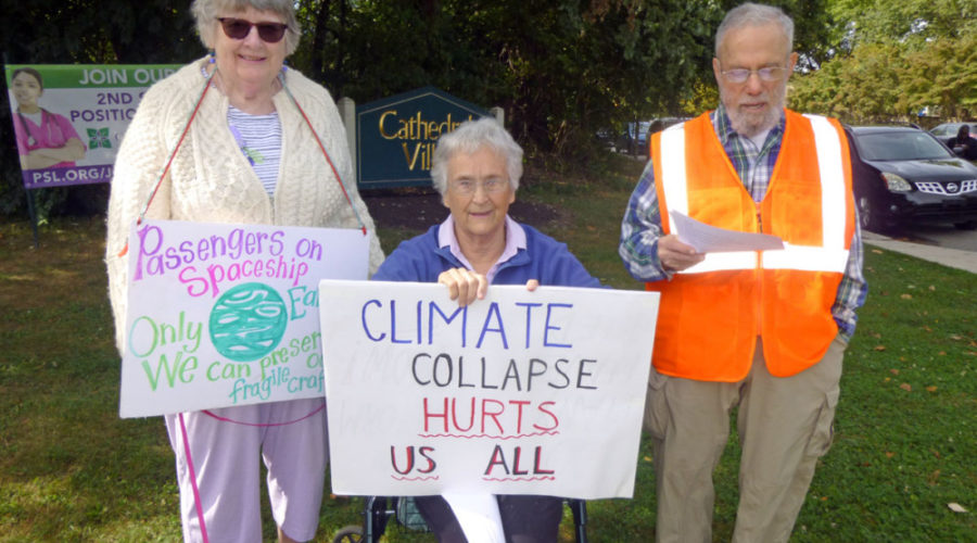 Seniors stand (and sit) in solidarity with millions who spoke out against climate change